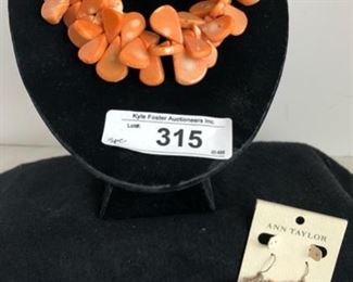 Carved salmon coral choker, orange beaded stretchy bracelet, and a pair of Ann Taylor coral pierced earrings 
