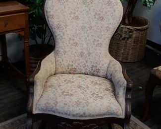 Antique upholstered rocking chair