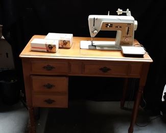 Singer sewing machine and cabinet with accessories