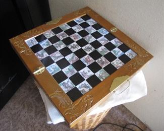 Chess set with chess pieces in drawers under the board