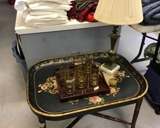 Tray table with gold decorated glasses and lamp