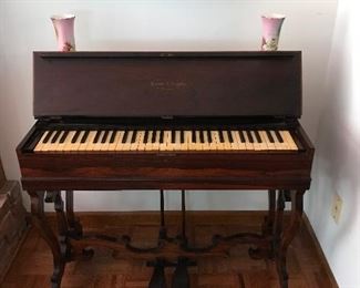 Photo of the Civil War Era Melodeon Organ with the top lifted.  Keys are in excellent condition, as is the cabinet.  Bellows do need replacing before it can be played.