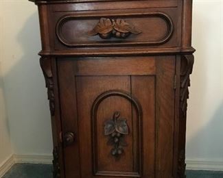 Elegantly styled with fruit motif, this Antique Commode compliments the Cherry Andrew Carniege bedroom suite well.
