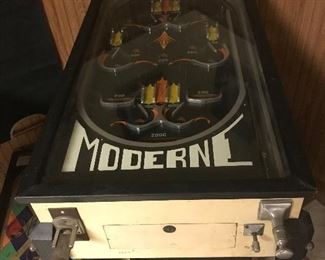AVAILABLE at the AUGUST 22/23 Sale!  This “Moderne” Pin Ball Machine is a classic Arcade Game that is still popular today! 