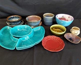 Pottery and Stoneware Pieces	
Includes bowls and plates. 12 pieces total.