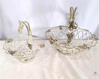Vintage Silverplated Baskets	
Vintage Godinger Silver Art Grape Fruit Baskets with Handles. Silver-plate. Set of 2. Large is approx. 12" in diameter and smaller is approx. 8" in diameter