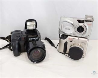 Olympus Cameras	
Includes 3 Olympus Cameras. 1 film and 2 digital. Olympus IS-1 with broken flash chamber (will not stay closed). Olympus C-720 Ultra Zoom. Olympus D-550 Zoom with broken flash chamber (will not stay closed).