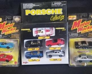 Maisto Porsche Collection of 1:64 Die-Cast Cars	
New in original Box/Packaging, 1 Porsche Collection of 5 1:64 Die-Cast Cars and 2- Motor Works Sets of 2 Die-Cast 1:64 Porsche Cars,