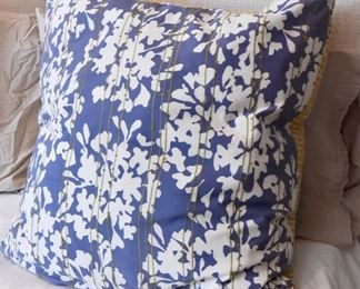 Blue floral pillows with green stripes of stitching  $20 each