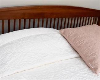 Queen Bed, arched headboard, and footboards with spindles. The footboard has significant fading from the sun. It is sturdy, and a perfect candidate for a painting project.  $150