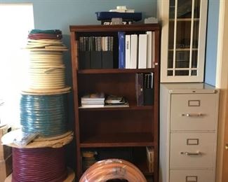 Various AudioQuest and Liberty structured cabling, Carlon 1.5" Resi-Gard, 1 of 3 matching bookcases, Hon heavy-duty letter filing cabinet with lock.