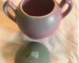 Niloak sugar bowl with loud beside 