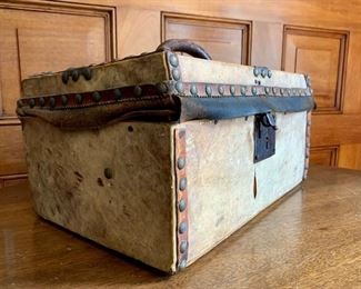 Item 12:  Civil War Era mid 1800's flat top leather covered document box or small trunk with brass lock and tack details, leather top strap with the hinged lid opening to a painted paper lined interior with label reading- E.A.G. Roulstone - This item has wear commensurate with its age - 12"l x 8"w x 6.5"h: $85