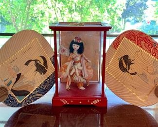Item 73:  Japanese geisha doll with two decorative fans:                                                                                           
Geisha in case - 7.5" x 10.5":  $38.00                                                                      Fans:  $22.00                                                                                                                                                                                                                                                                           