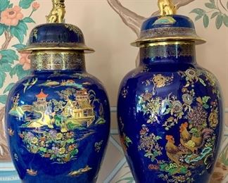 Item 76:  Carlton Ware Porcelain Covered Urn Cock and Peony Urn with Gilded Foo Dog Finial (right) - 25"  $750 pair                                                                                                            Item 77:  Carlton Ware Porcelain  Mikado (2364 Mottled Blue Lustre) Urn with Gilded Foo Dog Finial  2364. - 24"                                                                                                             