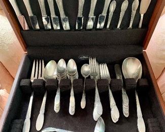 Item 111:  Rogers Bros. Flatware Set, Sylvia Pattern: $85                                                                                                               8 dinner forks, 8 knives, 6 dinner forks, 8 butter knives, 16 teaspoons, 2 serving spoons, 1 gravy ladle, 1 large serving spoon 