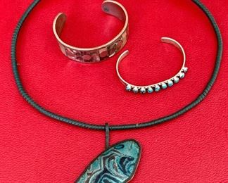 Item 529:  Sterling and abalone bracelet, Turquoise and sterling bracelet and a signed enamel necklace on a cord.    All three vintage pieces $65.00.