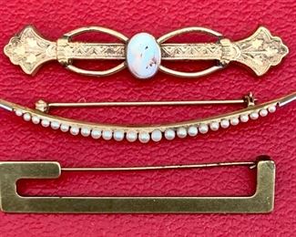 Item 591:  Three pins.... Middle one has beautiful seed pearls and is 14 K. gold.  Top one is  an antique cameo and the bottom one  is also a nice vintage selection. $125.00 for all three.