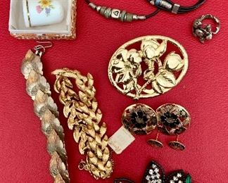 Item 593:  Lot of costume jewelry and a thimble.  $8.00