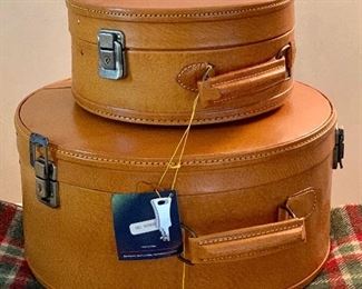 Item 370:  Set of two round suitcases $65.00...new with tags.