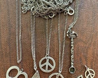 Item 326:  Lot of assorted peace symbol necklaces (pendants are sterling, chains are not marked:  $30