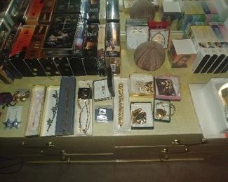 Costume jewelry, VHS tapes, Snow globes