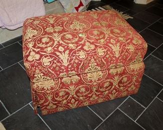 Red upholstered ottoman