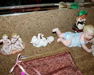 Piano babies, figurines, dolls