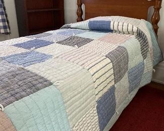 Two twin beds with very cute quilts