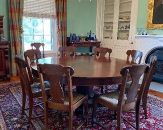 Gorgeous custom made dining table--seats 8 as shown and 12 with the two leaves inserted