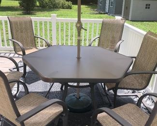 outdoor octagon patio set. 6 chairs, patio umbrella, umbrella holder and outdoor rug available