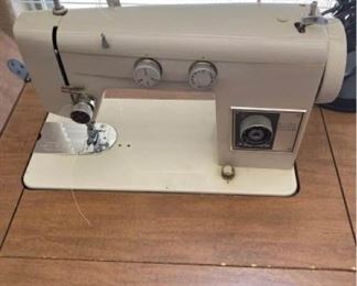 Signature Sewing machine in cabinet