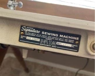 Signature Sewing machine in cabinet