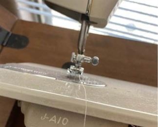 Signature Sewing machine in cabinet