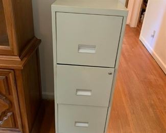 #10	3 drawer metal file cabinet Letter w/key  41" Tall	 $25.00 
