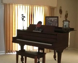 Baby Grand Piano Cuatomer made for for the owner. As a special and best friend of famous pianist Liberace, the owner would only agree to have this piano custom made if it were one that Mr Liberace would play. Thus this piano is styled much like the Baldwin style. 