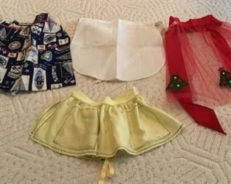 A sample of many Vintage Aprons we have on display at this house.  The white center apron is the old “Krystal” Restaurant “rick rack” trim cafe apron.  We have over 30 different sizes, ranging from dainty to formal, everyday to laundry day. For the collector you need to see these beauties.