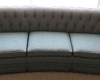 Oversized custom made formal sofa made for thee circular picture window.