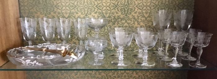 Assortment of wine glasses and a serving dish. 