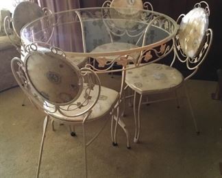 Pretty glass top table with 4 chairs