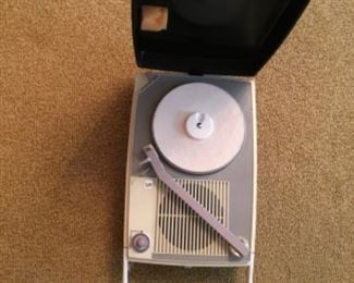 1950’s Singer 45 Portable Record Player. Comes in original case.