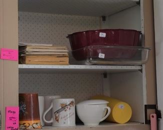 mugs cook books, pyrex and a bundt pan