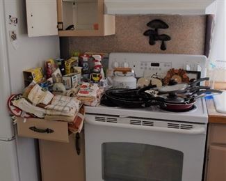 bundles of kitchen linens, products and fry pans