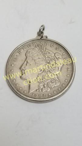 Morgan silver dollar with bezel