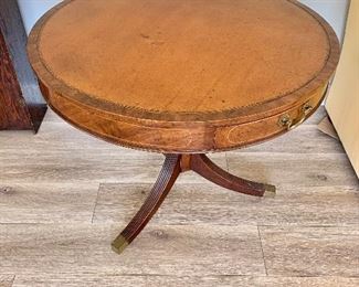 $450 Antique leather-top, inlay pedestal table with three drawers 32" diam, 27.5" H. 