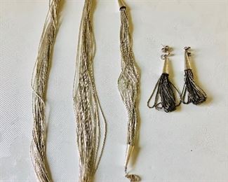 $95 Liquid silver set, Necklace $50 bracelet $25, Earrings $20 Necklace 18" L , Bracelet 7 and 3/4 inches L and earrings are 2.5 inches long