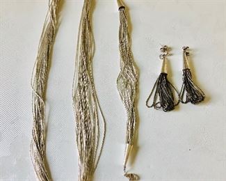 $95 Liquid silver set, Necklace $50 bracelet $25, Earrings $20  Necklace 18" L , Bracelet 7 and 3/4 inches L and earrings are 2.5 inches long 