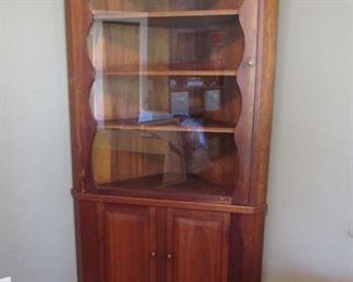 Handmade Cherry wood corner cupboard. 34" x 80". Hand crafted in 1958 in Springfield, PA. Solid cherry with oil rub finish.