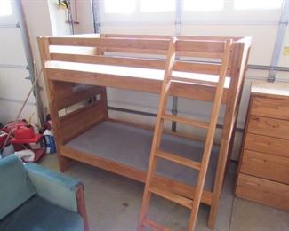 Rustic wood bunk beds with ladder.  