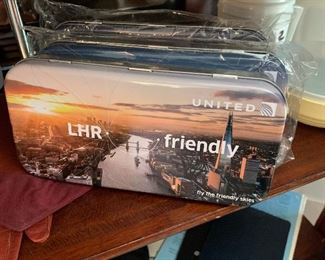3 United passenger courtesy gift can filled w/Comb, pen, ear plugs, tissue, hand wipes, socks, eye covers for a good nap and a Welcome letter 